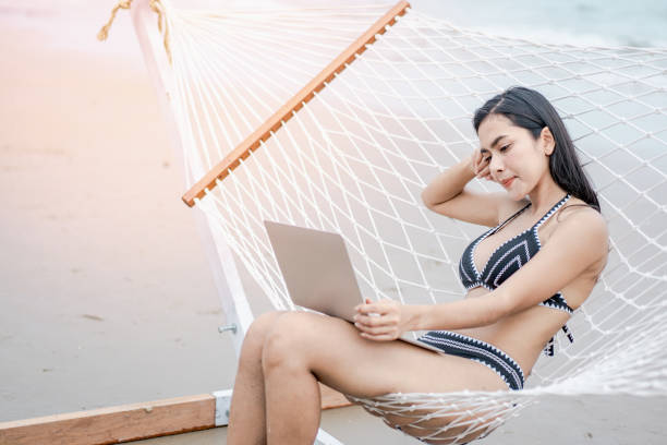 istock A woman is working on her vacation. 1256513081