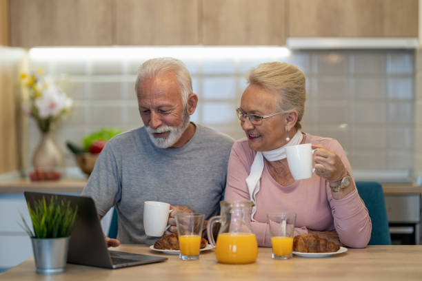 istock Senior couple enjoying their breakfast together 1256514761
