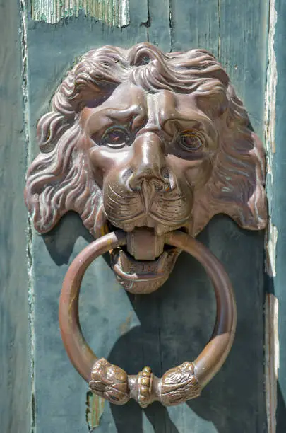 Lion head door knocker on the streets of Lisbon, Portugal