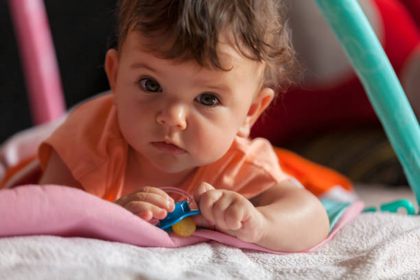 istock baby lying on her stomach 1256515841