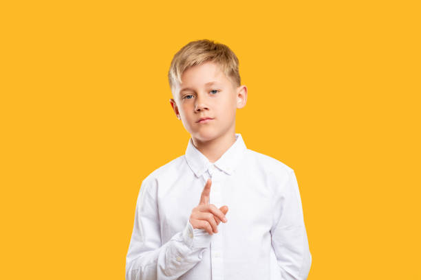istock denial gesture confident boy warning finger orange 1256519527