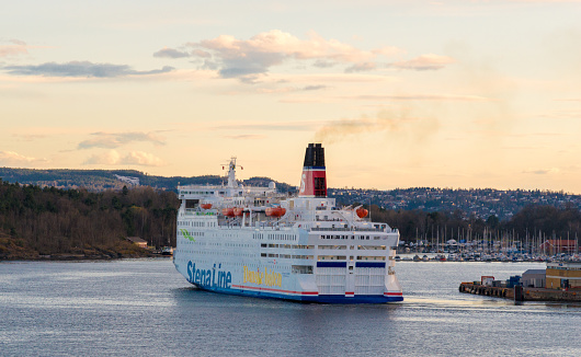 Oslo, Norway. April 25. 2018. Stena Line is a Swedish shipping company. Here the ship leaves the port of Oslo and sets off on its journey in the evening. This ship is called Stena Saga and is on its way to Stockholm