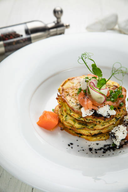 istock Pancakes with salmon, cheese, herbs 1256522043
