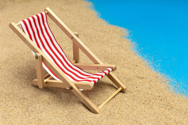 istock beach chairs on pastel blue background. summer vacation 1256522120