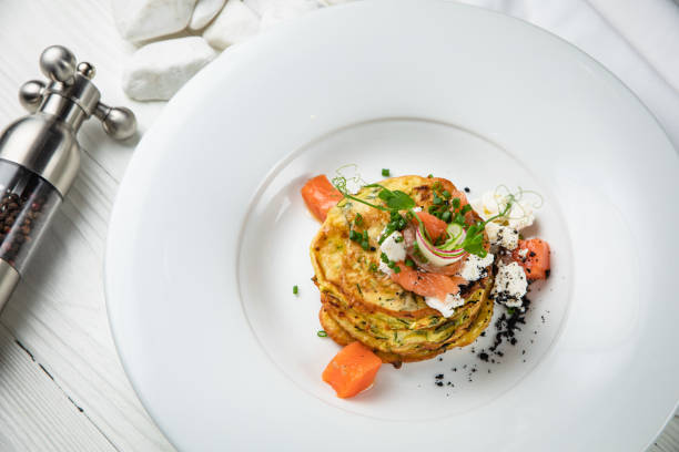 istock Pancakes with salmon, cheese, herbs 1256522175