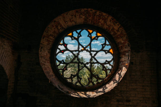 istock Round stained glass window in old abandoned castle 1256522421