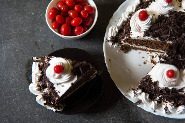 istock A slice of Black forest cake with condiments 1256525540