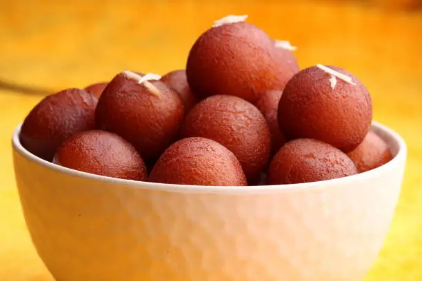 famous Indian dessert made up from fried milk solid balls and socked in sugar syrup