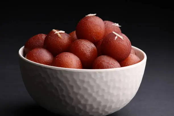famous Indian dessert made up from fried milk solid balls and socked in sugar syrup