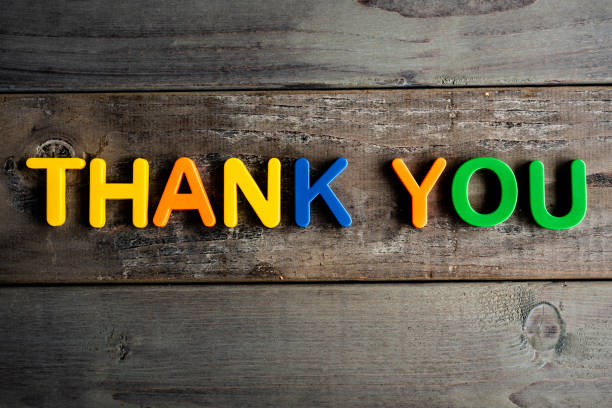 istock Thank you letters on wooden table 1256528726