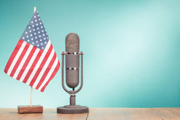 usa flag and big retro old microphone on wooden desk front mint green wall background. vintage style filtered photo - presidential candidate audio imagens e fotografias de stock