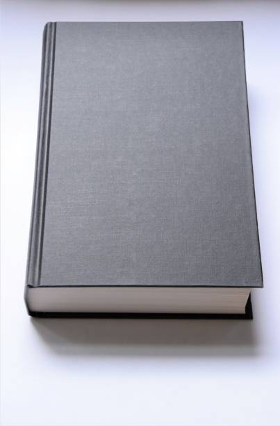 istock Black hardcover book on white background 1256528893