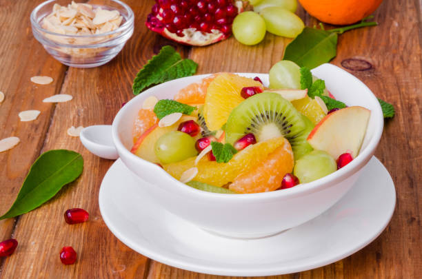 istock Fresh fruit salad in a bowl. Healthy dish. 1256530039