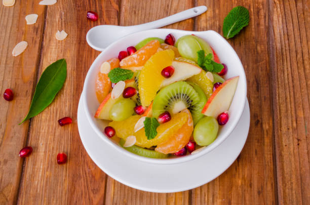 istock Fresh fruit salad in a bowl. Healthy dish. 1256530074