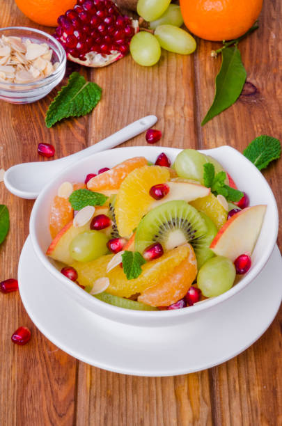 istock Fresh fruit salad in a bowl. Healthy dish. 1256530086