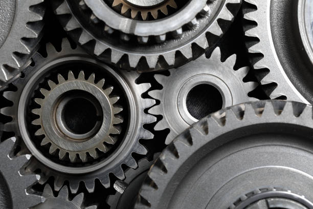 Machine Gears Mechanical gear combination close-up; top view machine part photos stock pictures, royalty-free photos & images