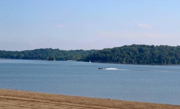 istock Speed Boat and Sailboat on the Lake 1256532367