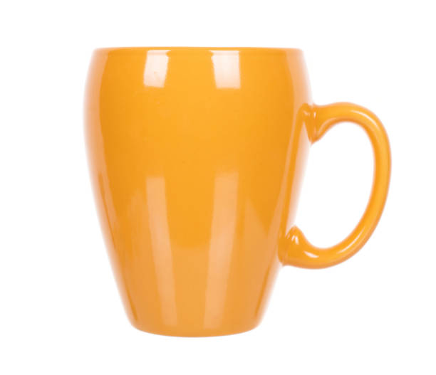 istock Yellow coffee mug, porcelain kitchen utensil. Isolated on white background. 1256535747