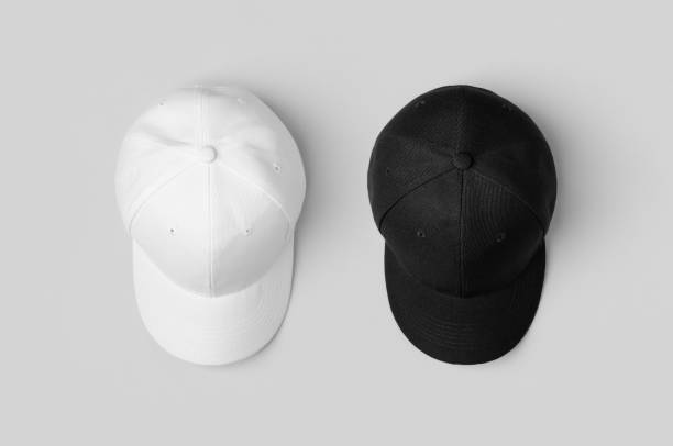 istock White and black baseball caps mockup, side by side. 1256537382