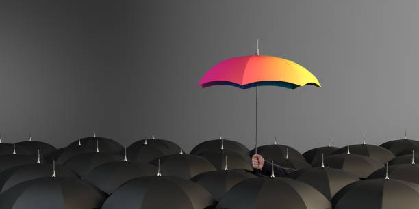 Unique Rainbow Colored Umbrella Business Man holding rainbow colored umbrella between the black umbrellas. ( 3d render ) bi black stock pictures, royalty-free photos & images