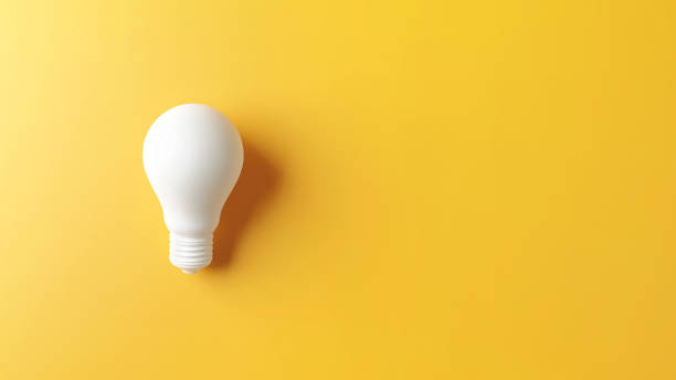 istock Ideas concepts, Creativity inspiration, White Lightbulb on yellow background. 1256541790