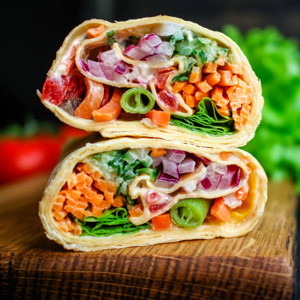 tortilla or burrito wrap stuffing vegetables vegetarian pita bread Menu concept Takeaway serving size. food background top view copy space organic