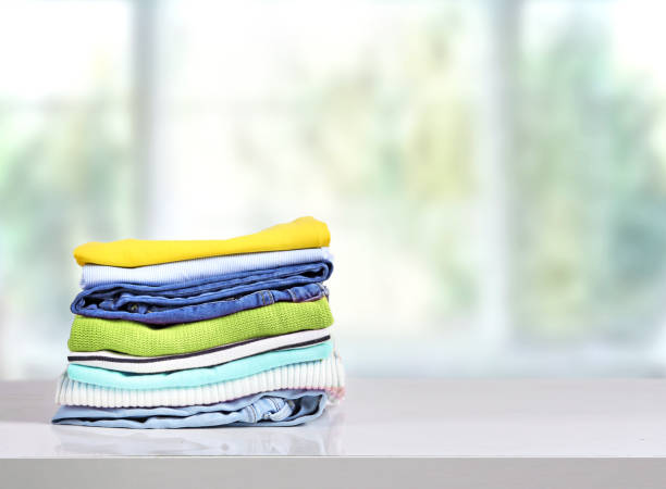 istock Stack of colorful clothes on table empty copy space,cotton clothing pile. 1256543317