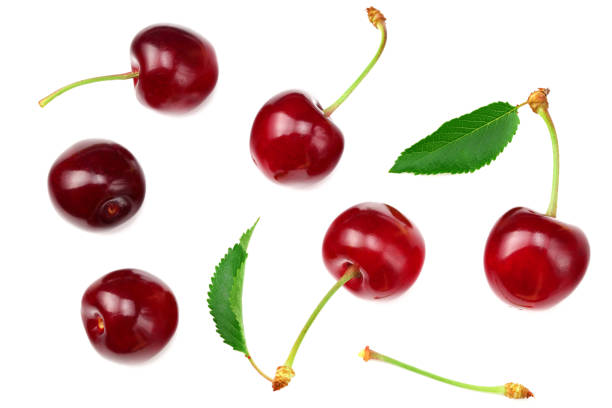 istock cherry with green leaf isolated on white background. Top view 1256544501