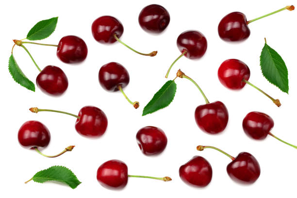 istock cherry with green leaf isolated on white background. Top view 1256544703
