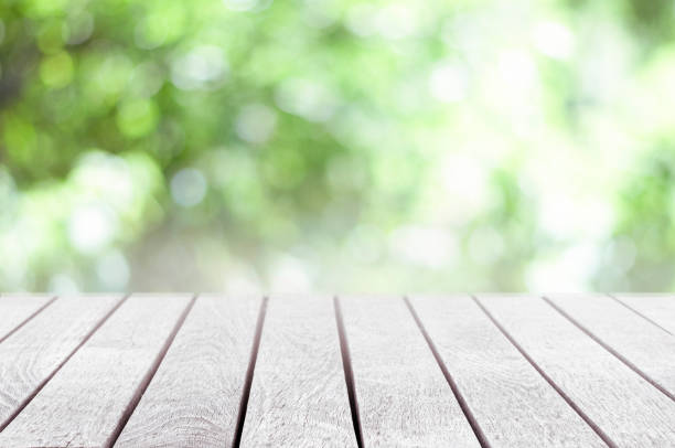 istock Wood table top on the nature background 1256546673