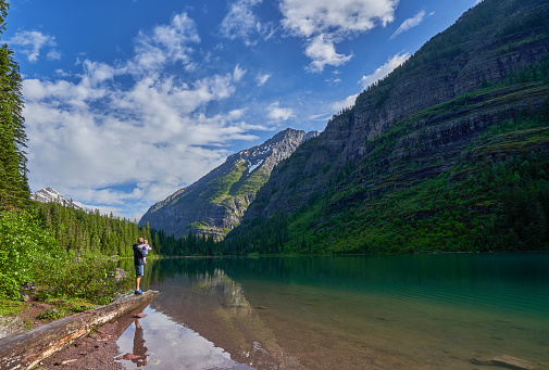 Father and Baby Daughter in the Beautiful Natural Scenery of Glacier National Park's Avalanche Lake Area in Montana, USA.