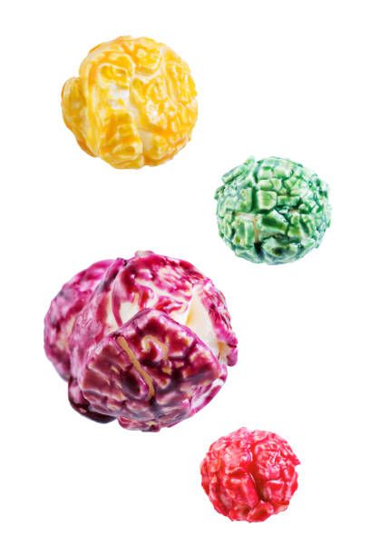 Sweet multicolor popcorn on a white isolated background