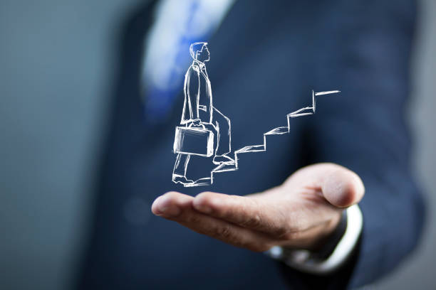 istock man hand a man climbing stairs in screen 1256547799