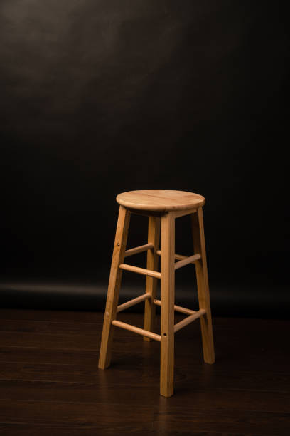 istock Stool in a Photography Studio with a Black Background 1256548257