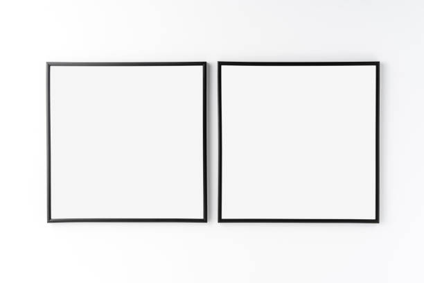 istock Mockup of two empty photo frames on white background. Home decoration 1256548666