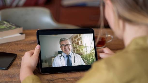 Doctor and patient talking on computer video call