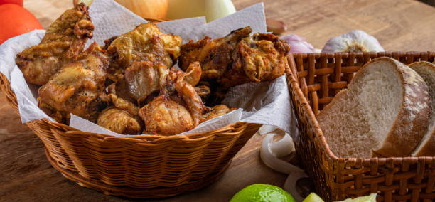 Brazilian style deep fried chicken and Sliced white bread. Called frango a passarinho Brazilian style deep fried chicken and Sliced white bread. Called frango a passarinho. chicken bird stock pictures, royalty-free photos & images