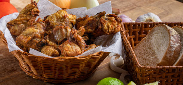 Brazilian style deep fried chicken and Sliced white bread. Called frango a passarinho Brazilian style deep fried chicken and Sliced white bread. Called frango a passarinho. nub stock pictures, royalty-free photos & images