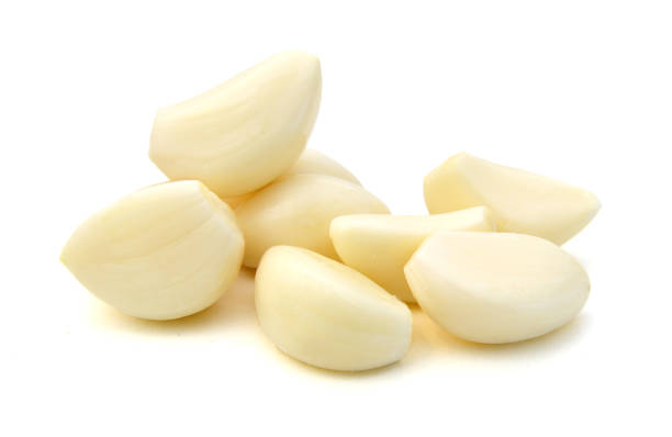istock Garlic cloves isolated on white background 1256550743