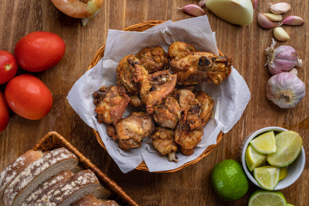 Brazilian style deep fried chicken and Sliced white bread. Called frango a passarinho. Top view Brazilian style deep fried chicken and Sliced white bread. Called frango a passarinho. Top view. nub stock pictures, royalty-free photos & images