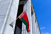 Large Belarusian flag on the wall of the Palace of Independence