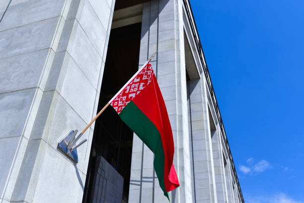 Large Belarusian flag on the wall of the Palace of Independence Large Belarusian flag on the wall of the Palace of Independence. belarus stock pictures, royalty-free photos & images