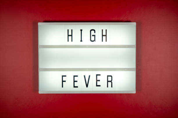 istock High Fever Title on LED Display Against Red Background 1256554268