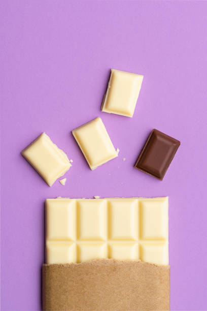 istock White chocolate pieces and one cocoa chocolate square. Stand apart from group 1256554841
