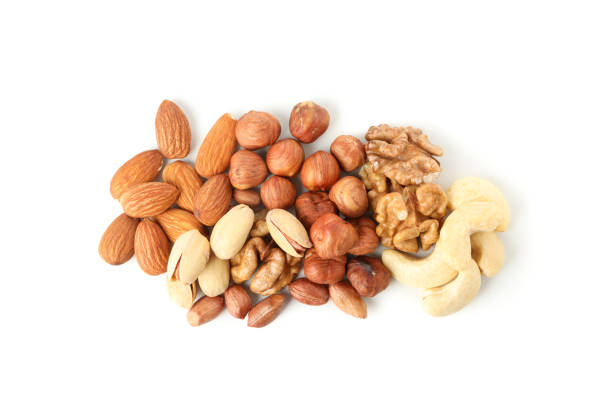 istock Different tasty nuts isolated on white background. Vitamin food 1256556238