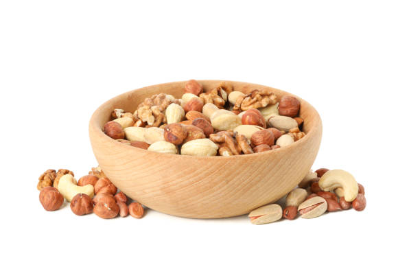 istock Bowl with different nuts isolated on white background. Vitamin food 1256556966