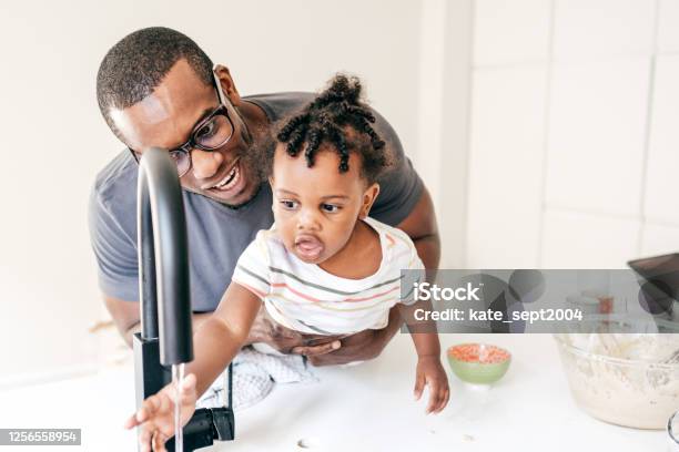 Baby Washing Hand Together With Dad Stock Photo - Download Image Now - 30-34 Years, Adult, African-American Ethnicity