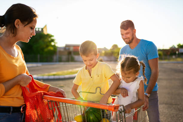 istock Family having fun after grocery shopping 1256559918
