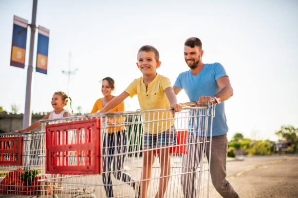 istock Family having fun after grocery shopping 1256560303
