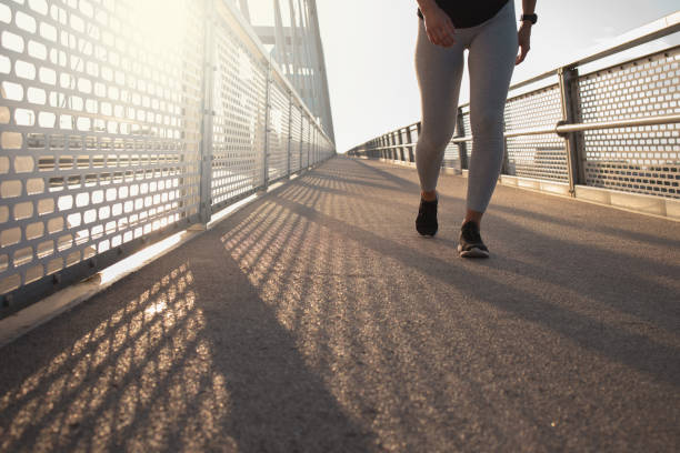 istock Young woman running at the Bridge 1256560359